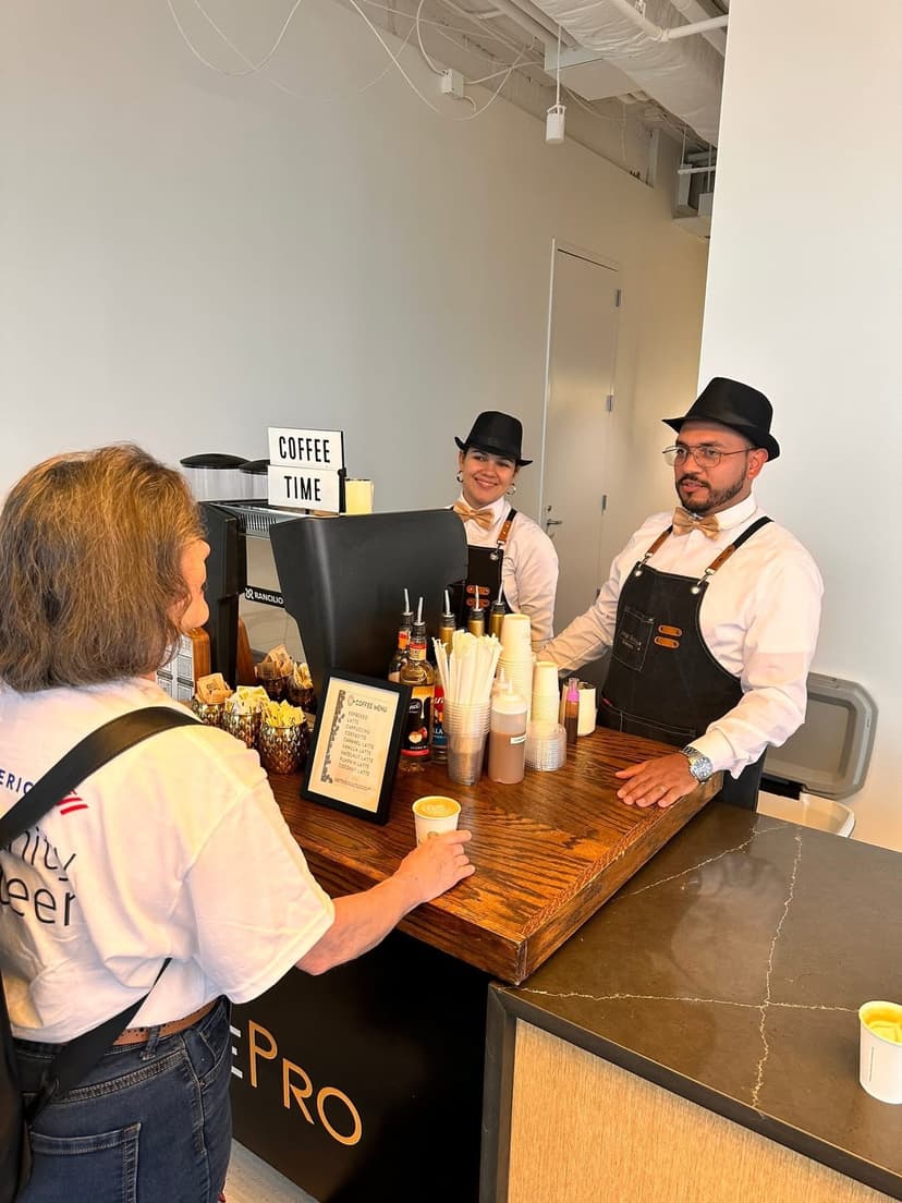 Professional baristas serving coffee at corporate event