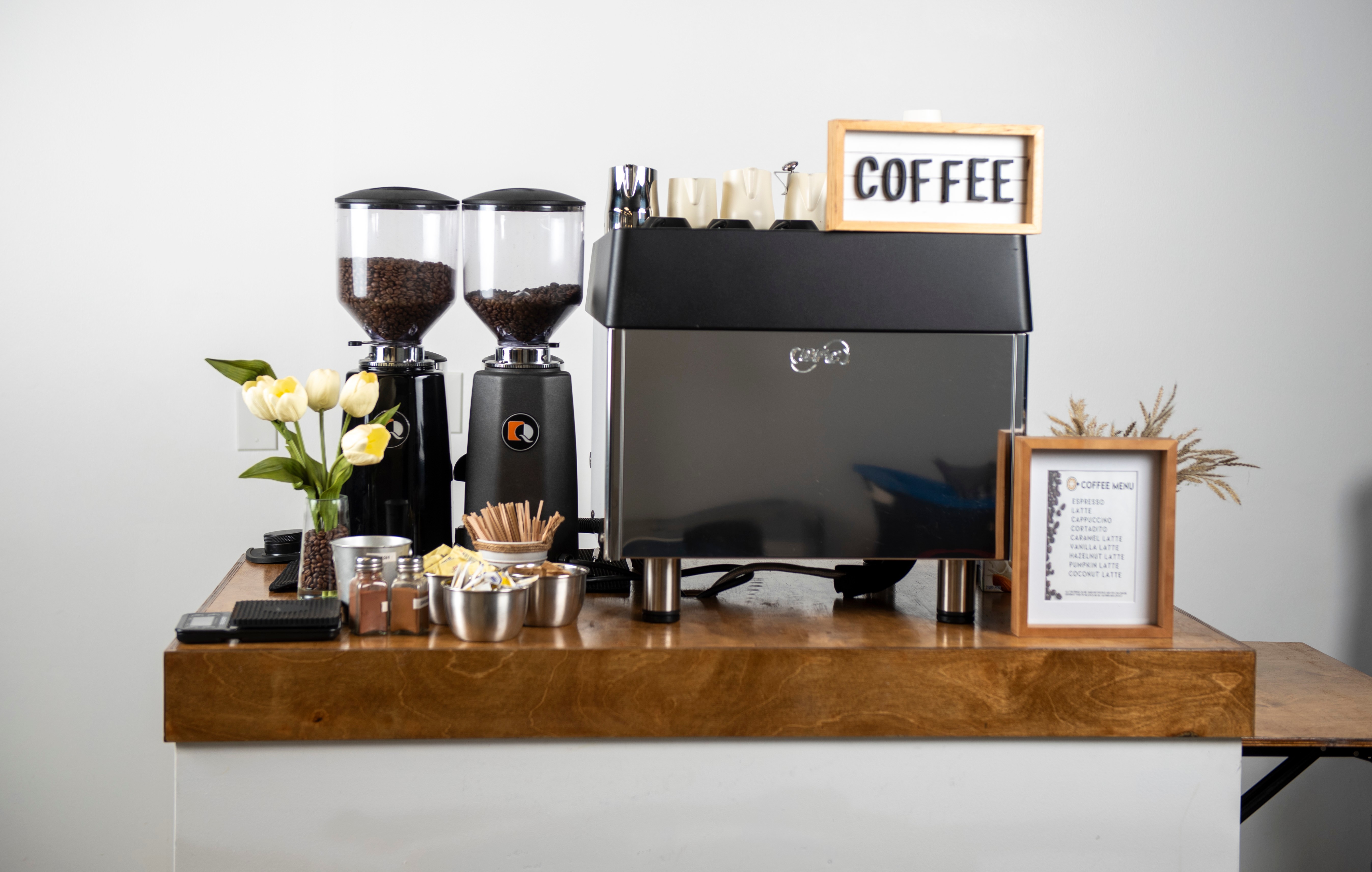 Professional coffee station setup with premium equipment and elegant presentation