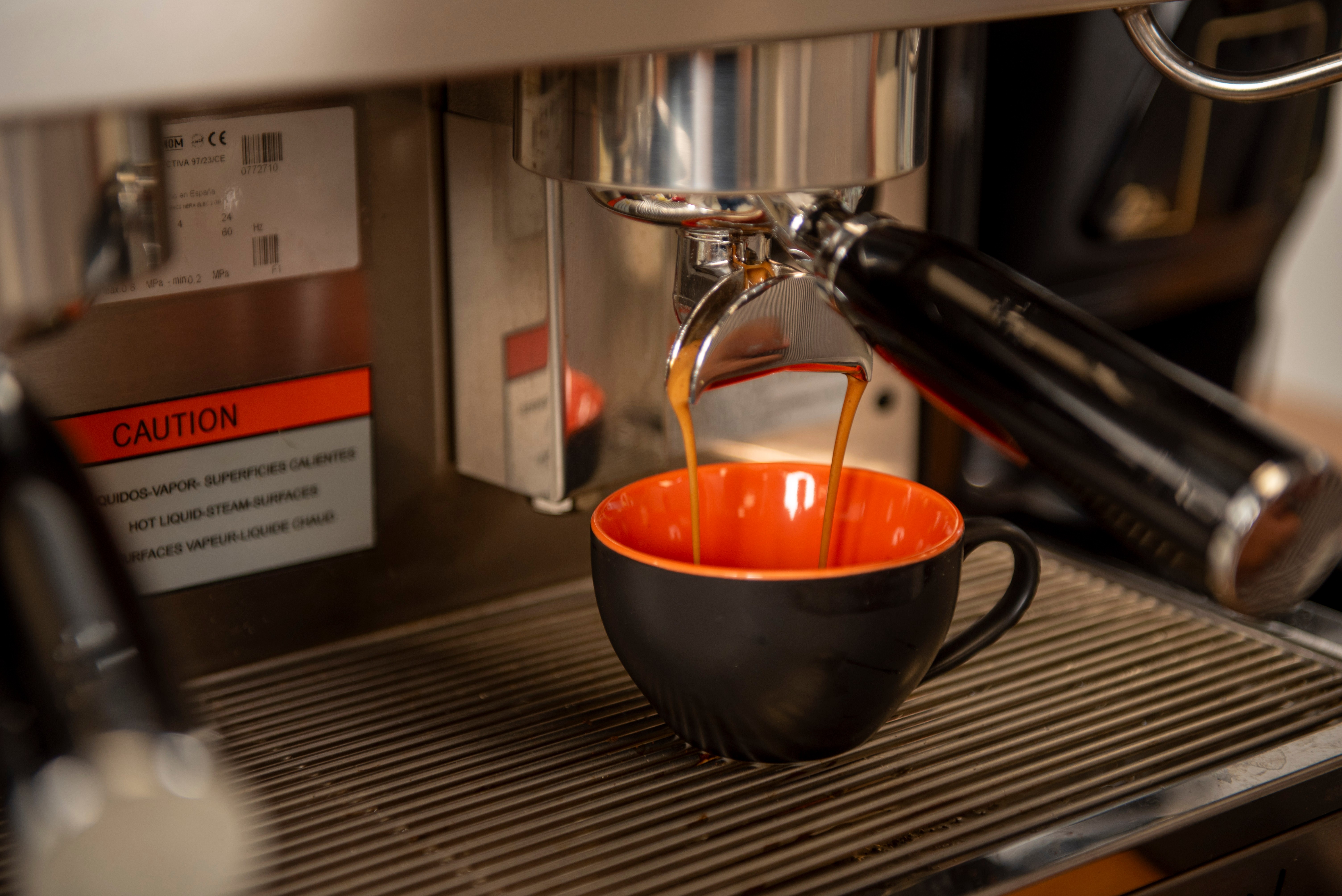 Professional espresso machine extracting perfect coffee